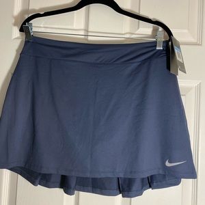 Nike golf skort size Medium with tags on. Dri-Fit Technology.
